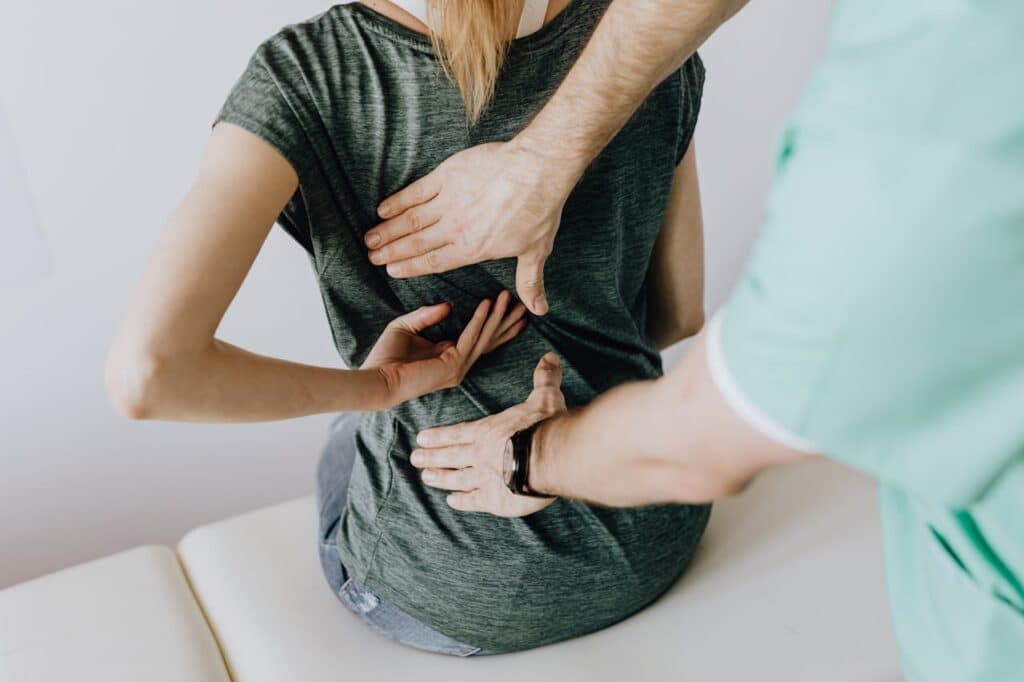 Chiropractor Helping With Back Pain